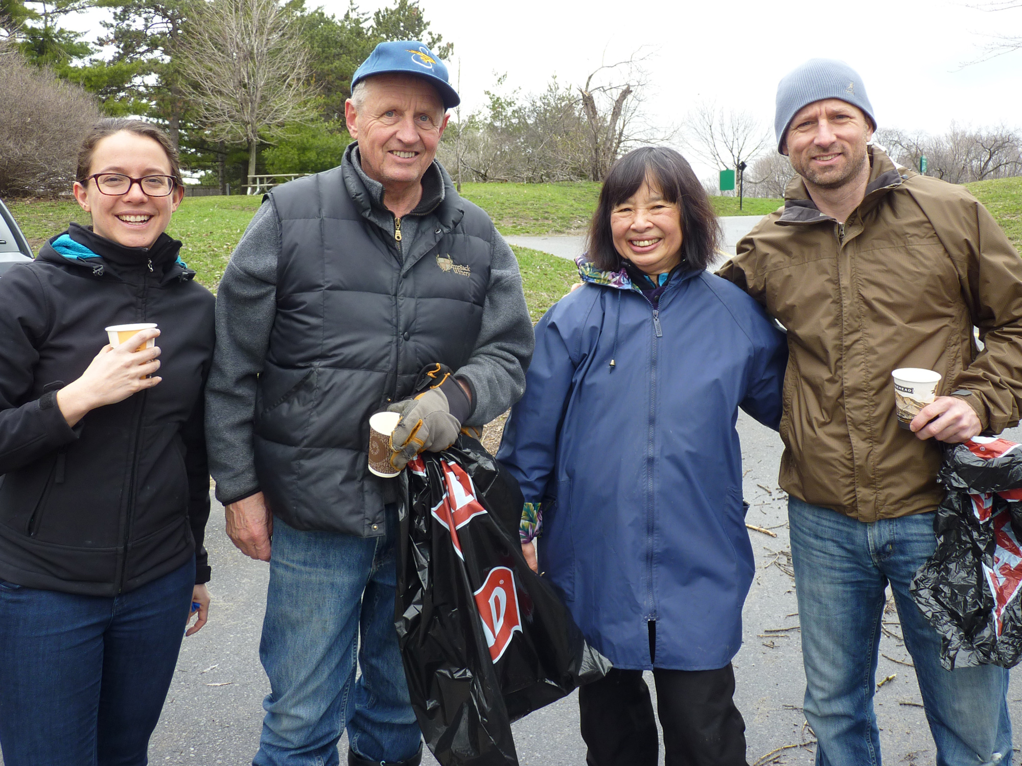 Members of the Westboro Beach Community Association working together with the Ottawa Riverkeeper (L-R): Julia Levin, Bob Huson, Mari Wellman, Mark Brooks.