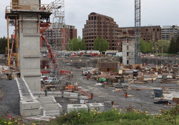 Construction crews begin work on the new Civic Hospital parking garage over the summer in 2024.