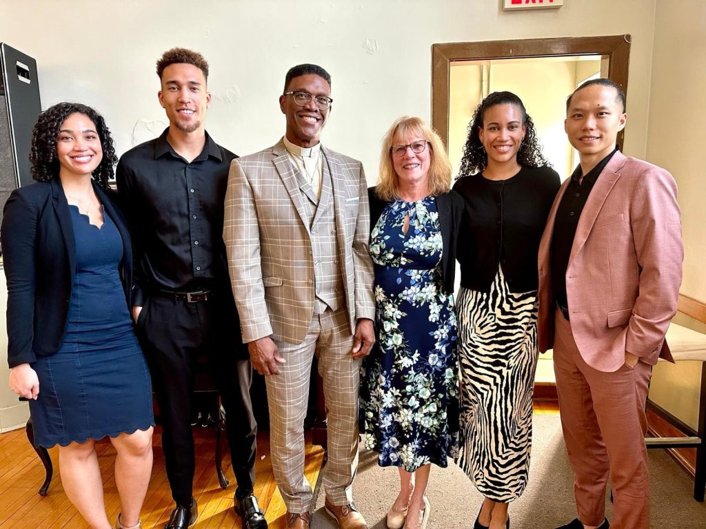 A group of people pose for a photo.